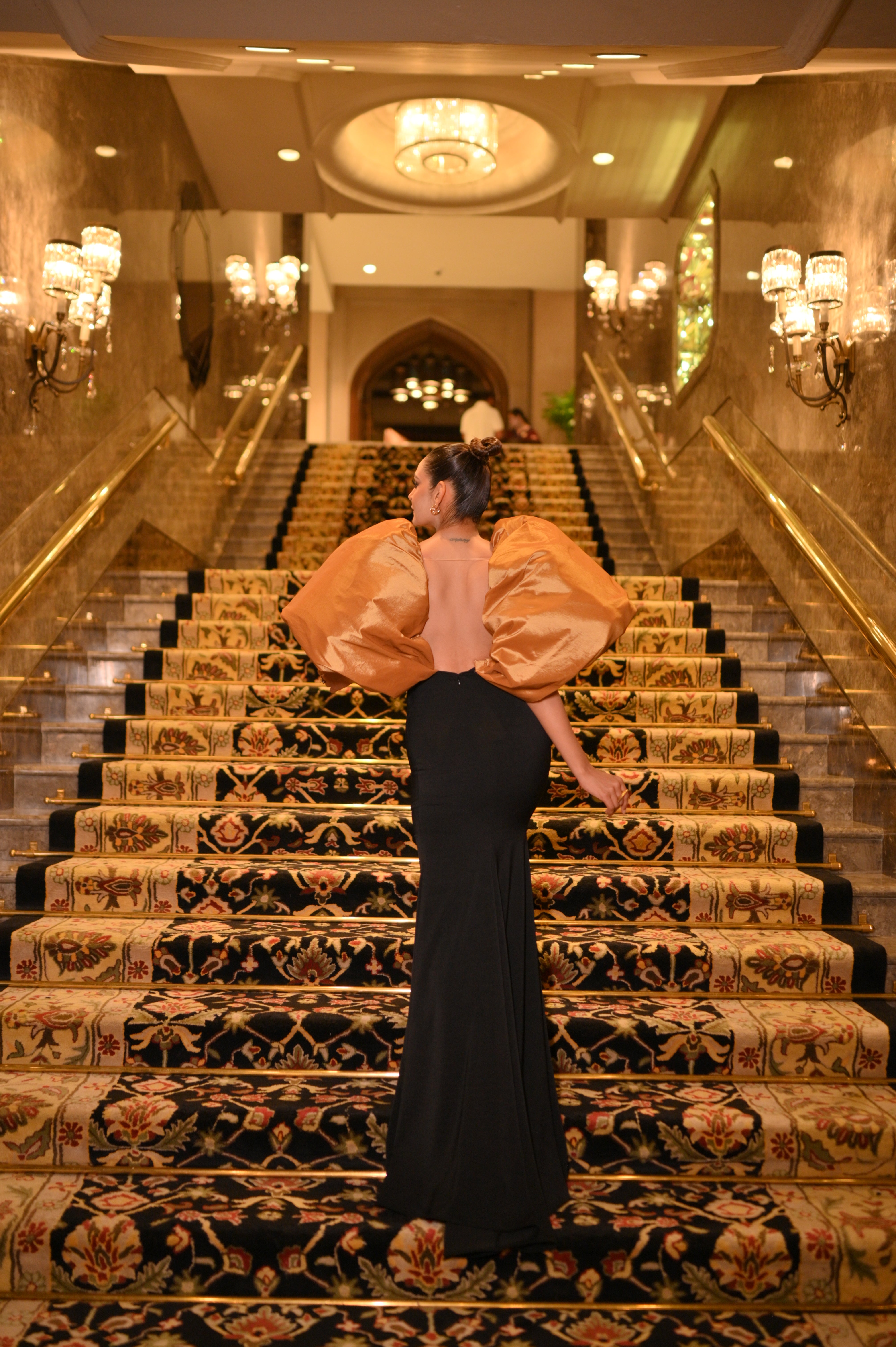 Black tail gown with puffed shoulder sleeves